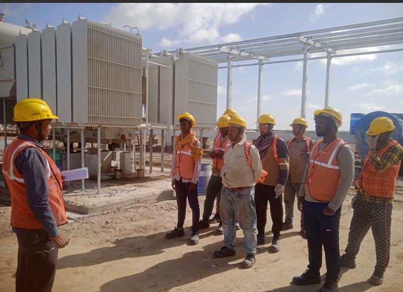 Site team briefing at transformer yard